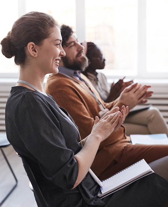 group of people clapping prosperity class